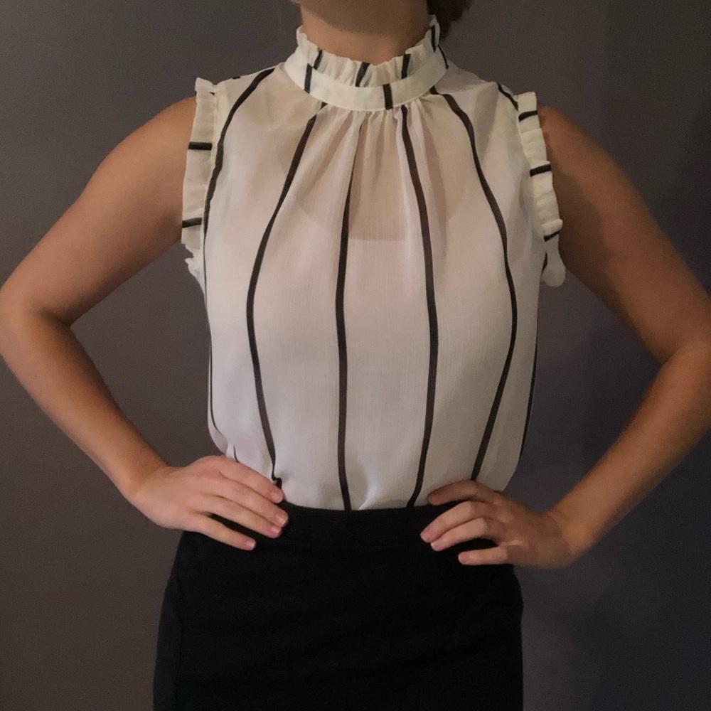 Ruffled neck and cap sleeve blouse